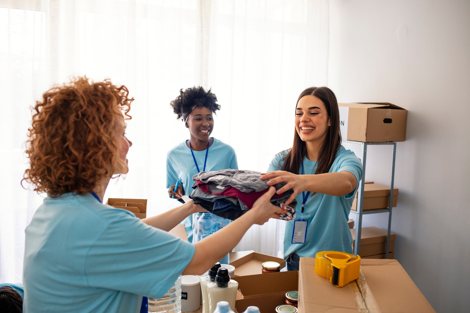 Volunteers holding boxes