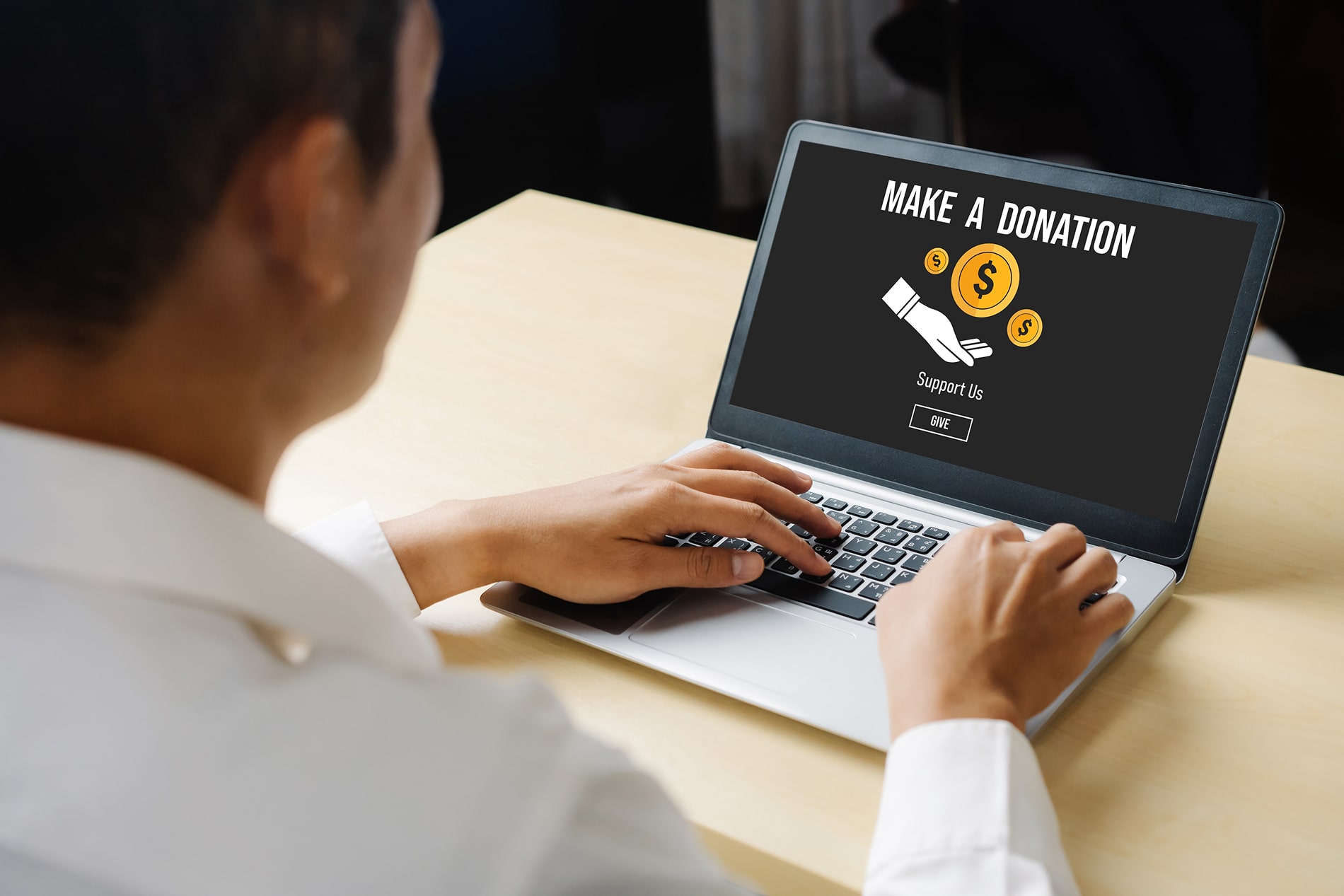 Man sitting at laptop.