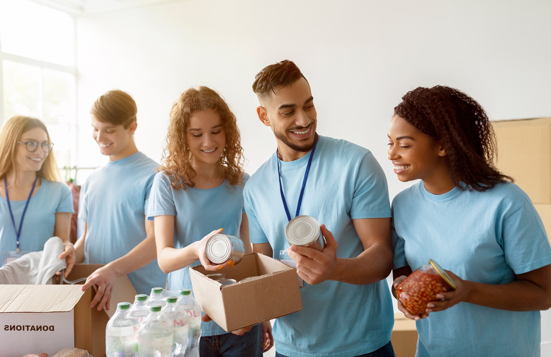 Volunteers packing boxes. 